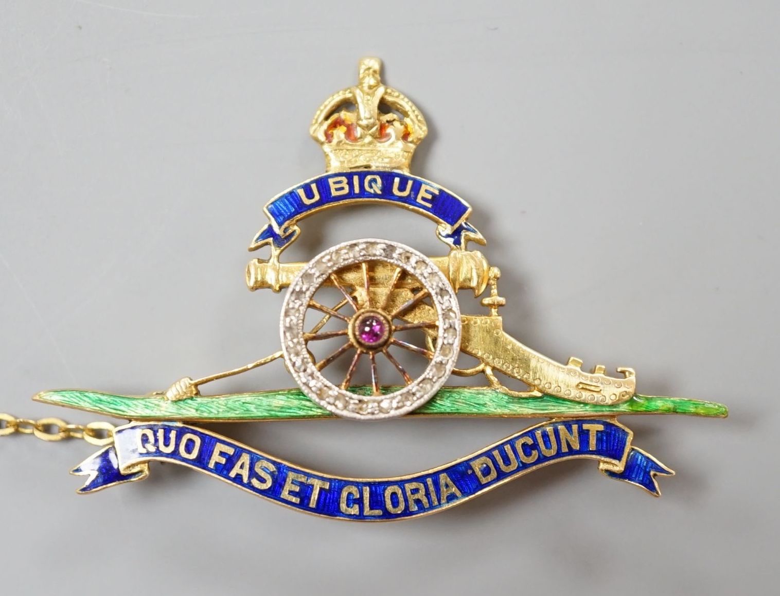 A 20th century yellow metal (stamped 18), enamel and diamond chip set Royal Artillery sweethearts brooch, 43mm, gross weight 8.4 grams.